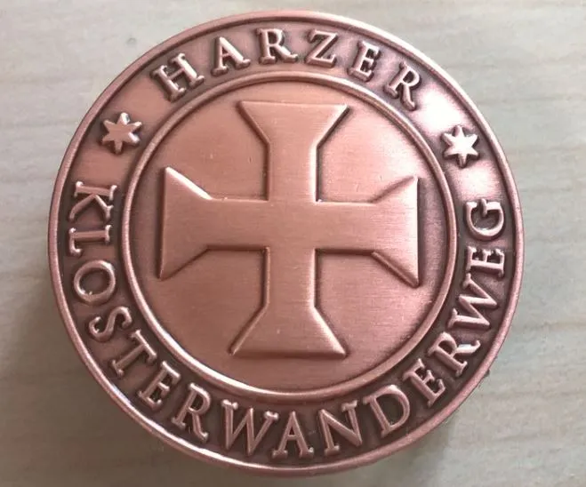 Bronze-colored Harz monastery hiking trail medal with cross symbol